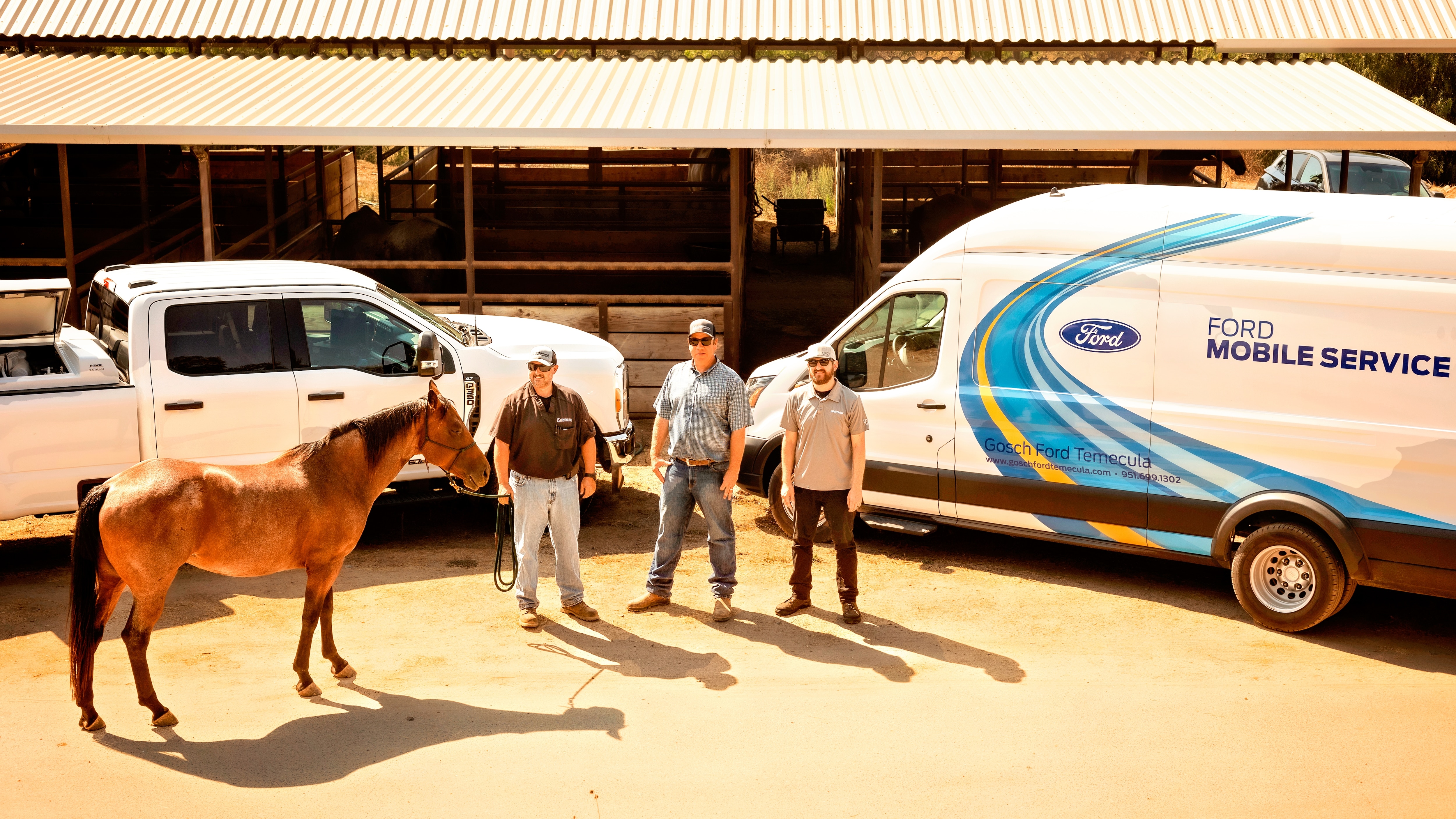 Dr. Bender (center) standing in front of his Super Duty truck and a Ford Mobile Service van with a horse, his vet tech, and a Mobile Service technician.
